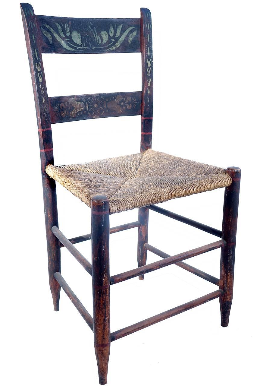 This is a solid set of antique and primitive looking 19th century rush seat chairs. The seats and finish are all original with a fabulous aged patina on wood. Some of the decorative paint has faded over time with some chairs showing more than