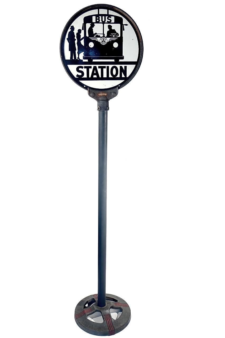 1950s porcelain over steel bus stop sign and pole. The sign is two-sided with one side almost perfect and the second side having a couple of quarter sized rust spots.
The Silhouette black and white graphics are clean and striking.