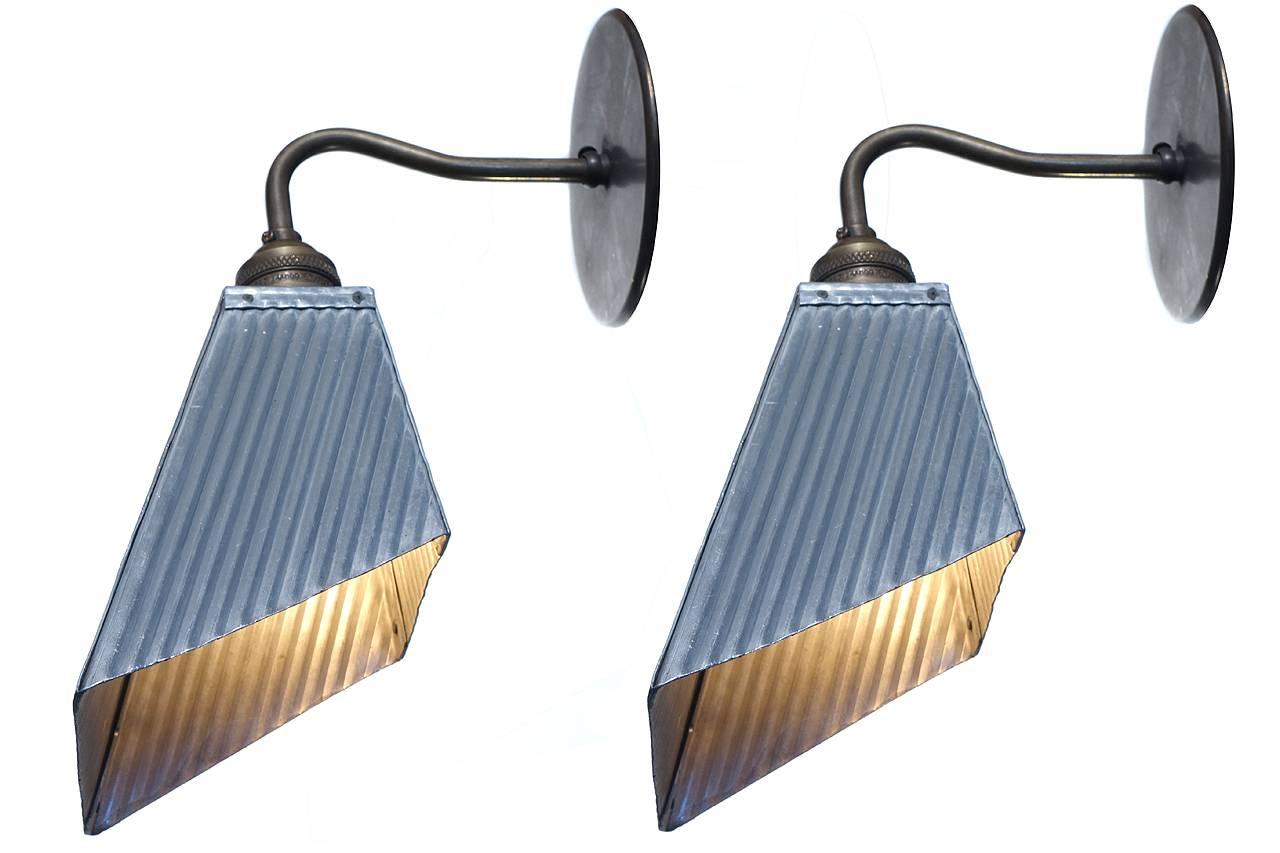 We only have a pair if these early aluminum shade sconces. I think they are from the late 1920s to 1930s. They originally were used as shades for machinist task lighting. The look is very unique. Its Industrial but has a very modern feel. I wish I