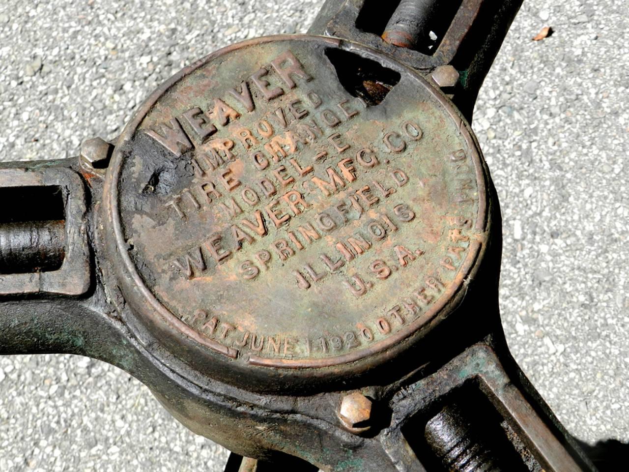 This is a sturdy Industrial table base that can comfortably hold a 48 to 60 inch top. The machine is all business sits on a graceful set of iron legs. It's signed weaver and dated 1920. The base is dining room height at 28 inches. You are buying the