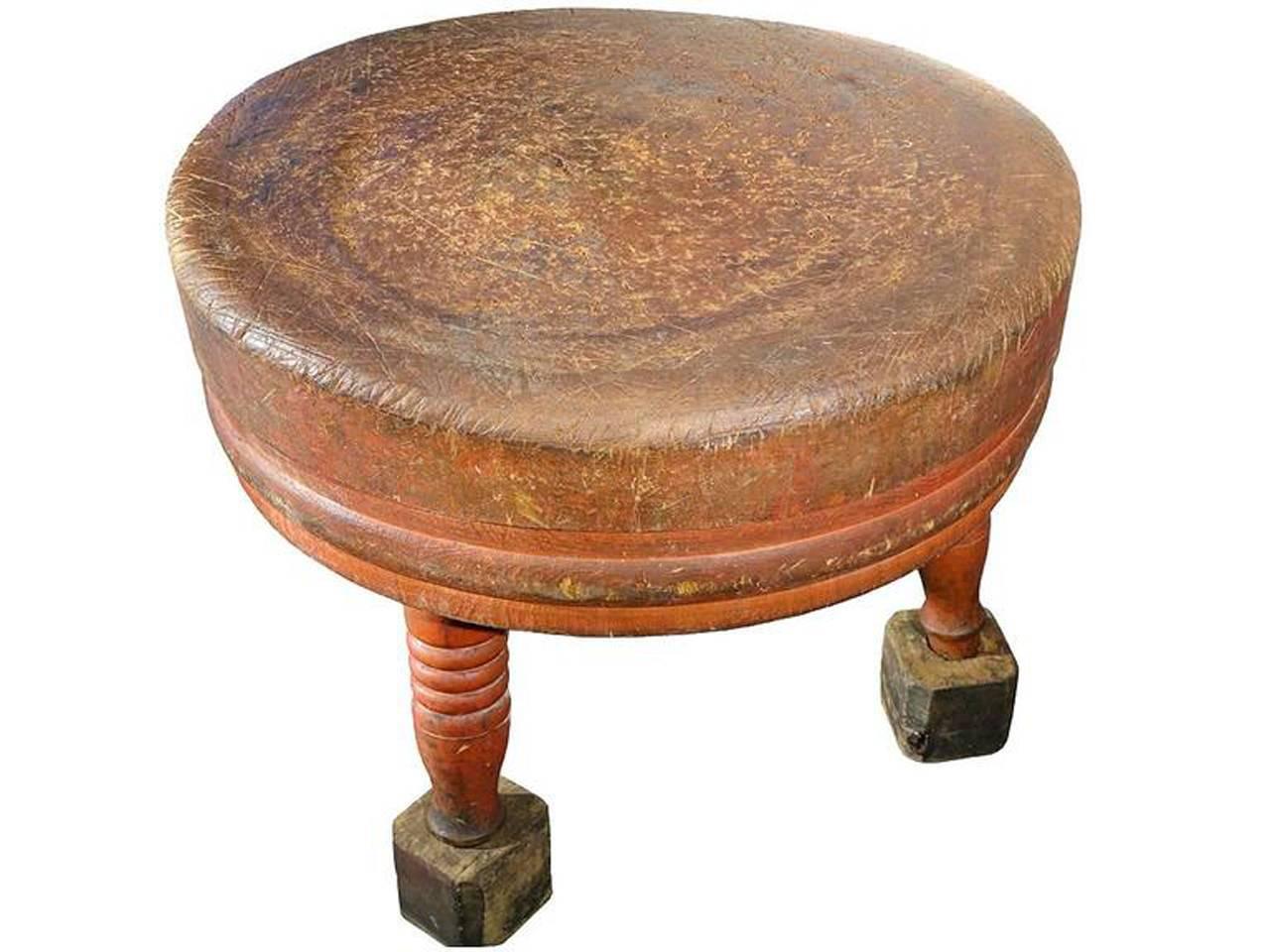 Early American made butcher's block, solid wood, with the original red milk-wash paint. Turn of the century from, circa mid-1800s. The block has an amazing patina that will only come from a 100 plus years of use. It has an impressive 3 foot diameter