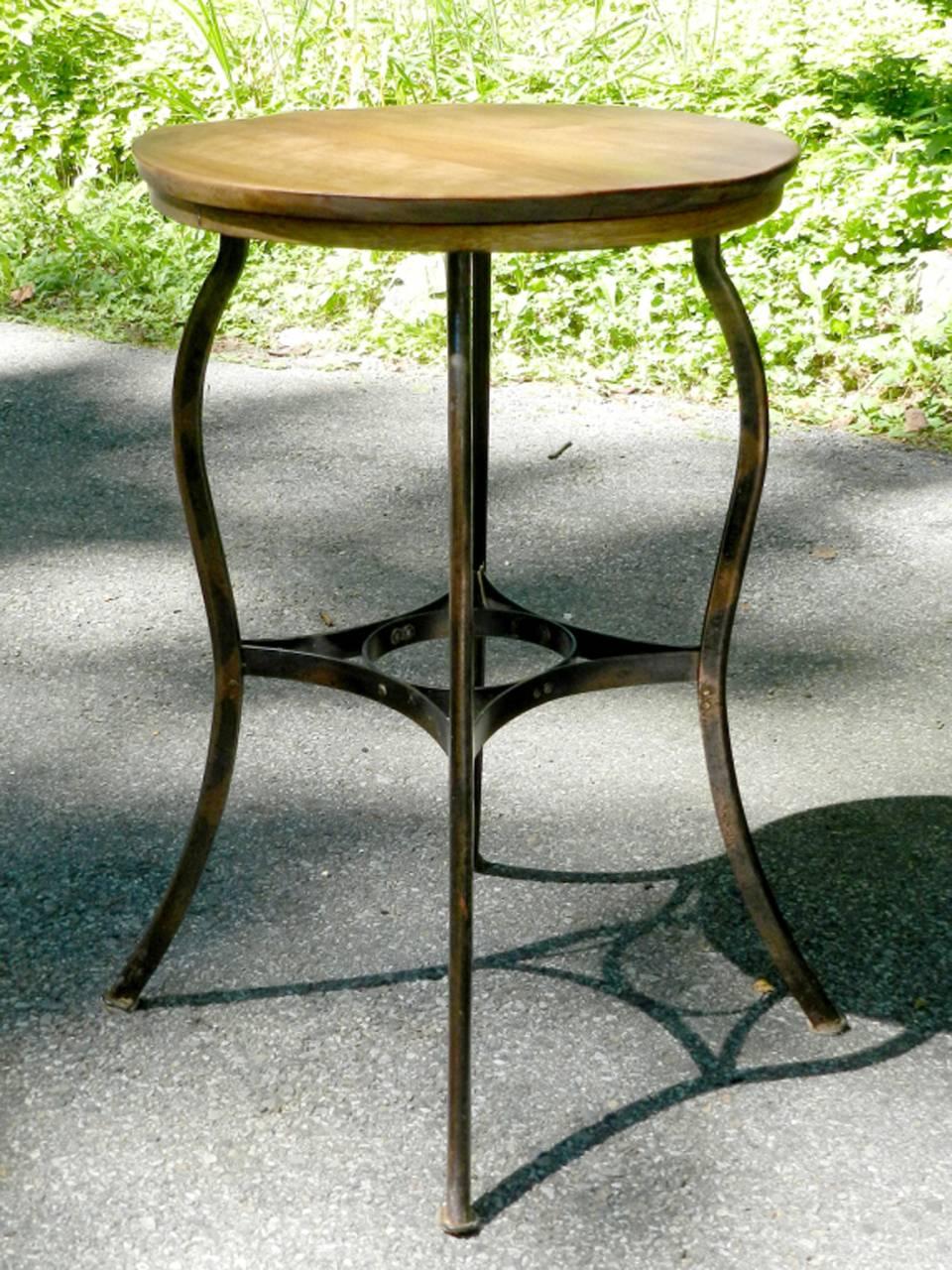 This is a nice solid steel and oak bistro table with a light and elegant look. It has a standard 29 inch table height with a petite 20 inch oak top. The small footprint and clean lines make this a very usable piece of Industrial furniture.