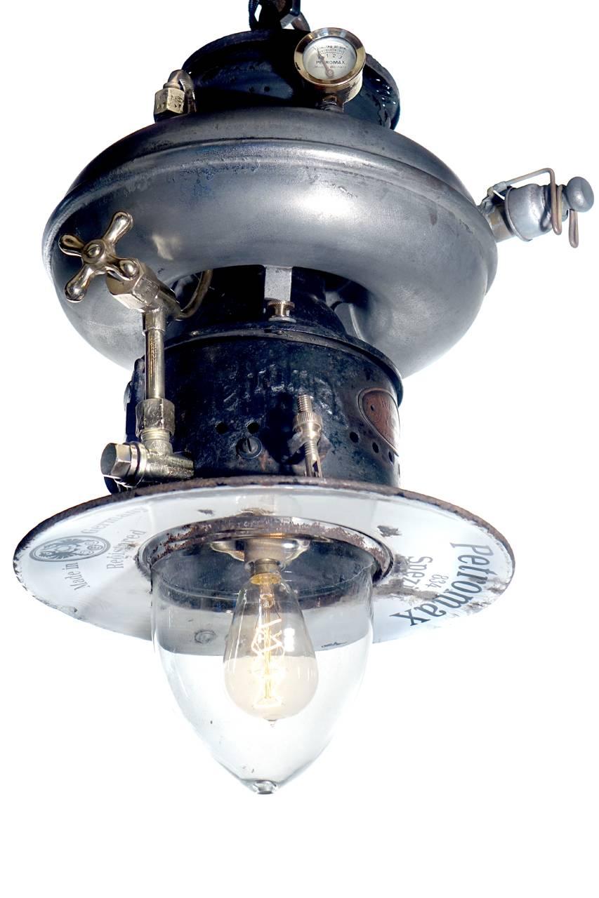 This is one of my favourite lamps and has brought them back from all-over the world. This example is German. This example is most interesting with its many details including: donut tank, original acorn glass shade, signed metal shade, maker’s oval