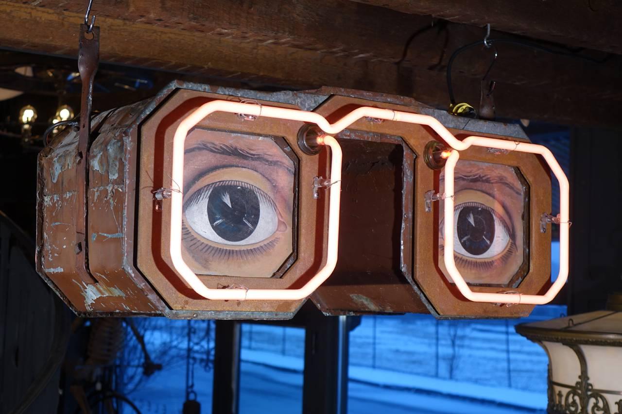 This is an early figural eyeglass sign that has been restored to perfect working order. The camera does not catch the vibrant red of this glowing neon. This is the type of sign we love the best. There is not a word on it but instantly you know what