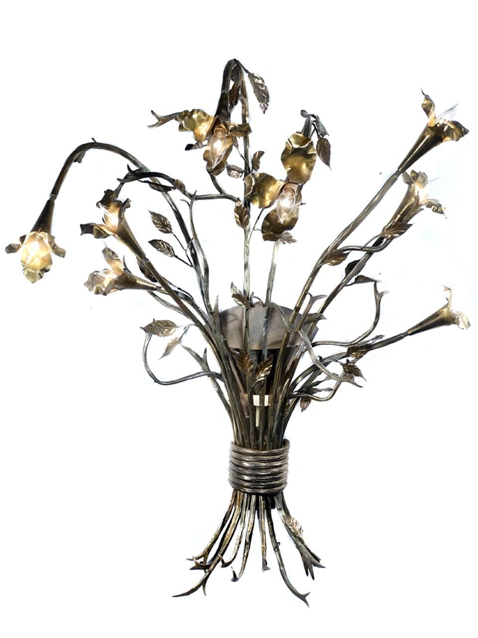These larger than life sconces are measures over 40 inches tall and 3 foot wide. Each lamp has eight flowers with candelabra bulbs and a ninth back light at the center of the bouquet. It was quite a job but everything is now freshly rewired. These