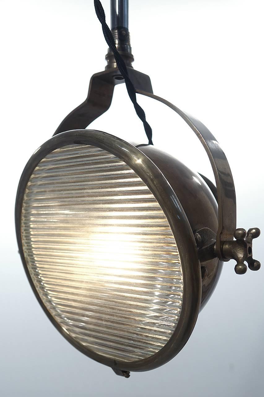 This medical arm spot light has a very unique Industrial look. The spotlight head was used as a dental exam light. It takes a standard bulb, has a prismatic lens and is perfect as a reading lamp.