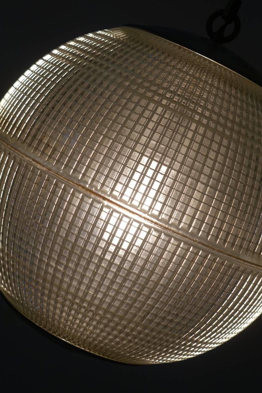 These iconic Mid-Century prismatic spheres once lighted the thoroughfares of Paris. If you have spent time there you know these lamps well. Since being saved from their lamp posts, these Industrial globes have been rewired for modern, indoor use.