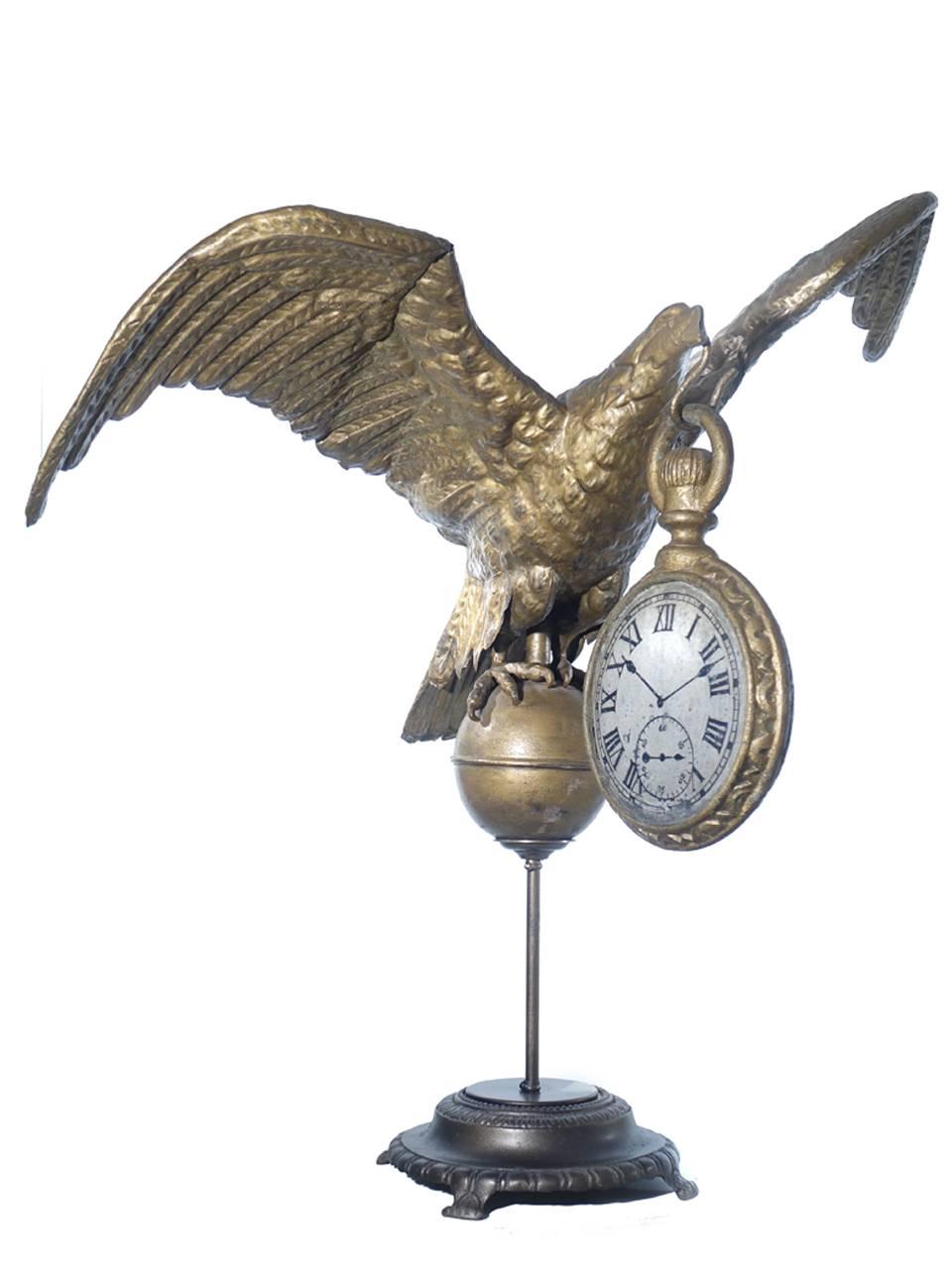 This is an impressive eagle sign with a 3 foot wingspan. The pocket watch is hand-painted cast iron and tin. There are a few small dents here and there but the overall look is amazing.
