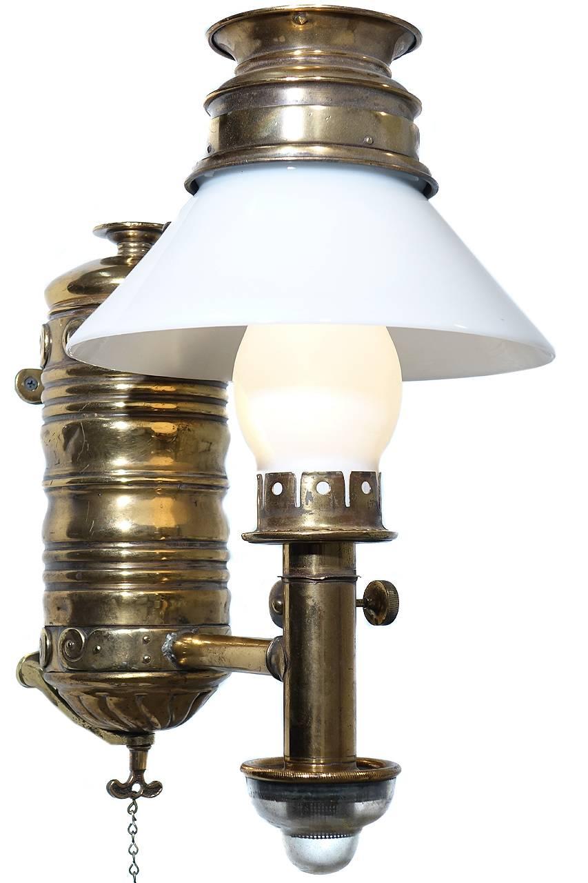 Few of these luxury class Victorian RR lamps still exist. Any remaining examples have found their way into museums and RR car restorations. This is a beautiful original sconce still retaining its lift out tank and valve. It also has the clear glass