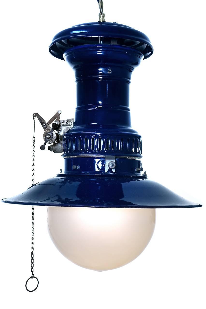 You don't see these in cobalt often. It in beautiful condition with the original globe and matching shade. Note the hole in the shade to allow the chain to hang straight. We kept all the original gas components when wiring for a standard bulb and