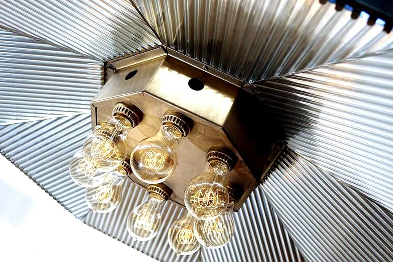 I've been doing this a while and in all the years have never got my hands on a rare one like this. Its a large original mirrored I. P. Frink reflector with an eight bulb cluster. The diameter of this octagon is over three foot. This lamp was