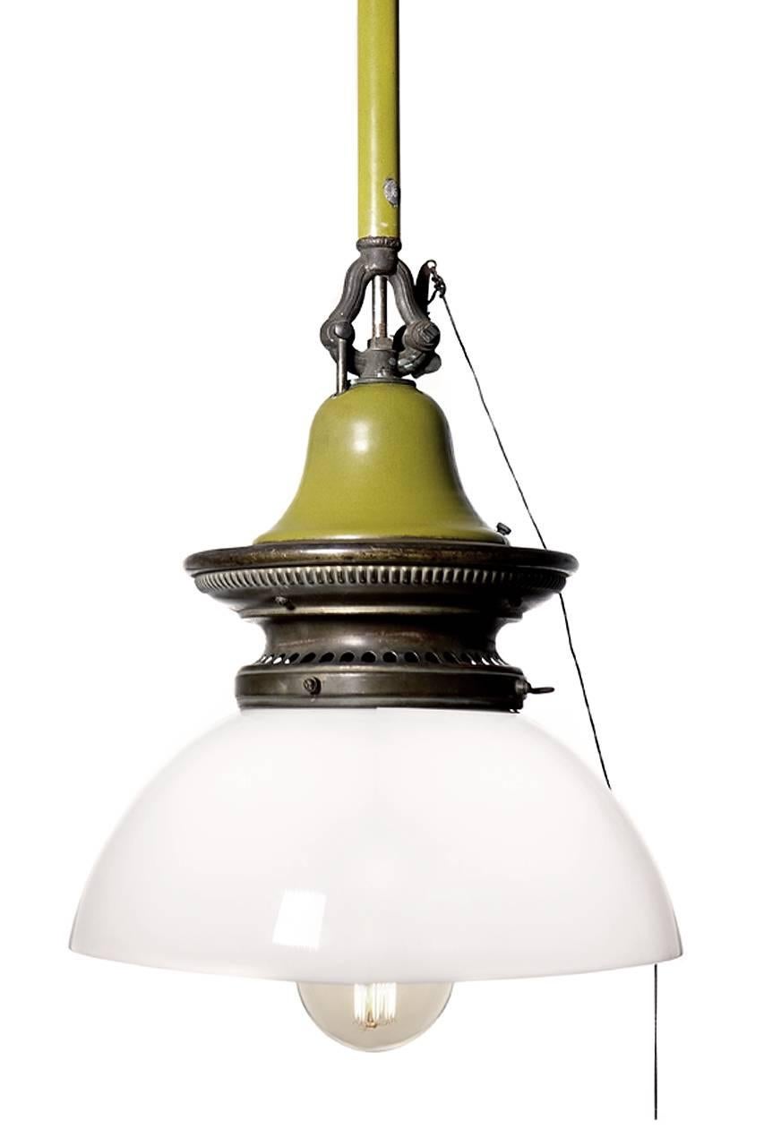 These are very unique lamps. The finish is brass with green porcelain highlights.
They are all original including the large milk glass domes. All were carefully wired to take a standard bulb without changing or loosing its gas era character. They