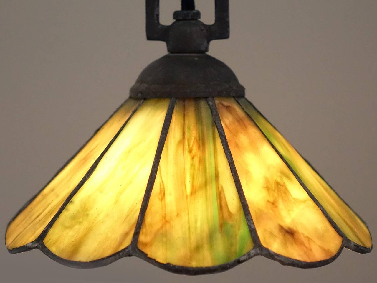 We have a small collection of these early stained glass pendants. Each are only 7.75 inches in diameter and have ten leaded panels with a scalloped edge. All the glass is in good shape with no cracks. The glass and lead have a weathered patina also