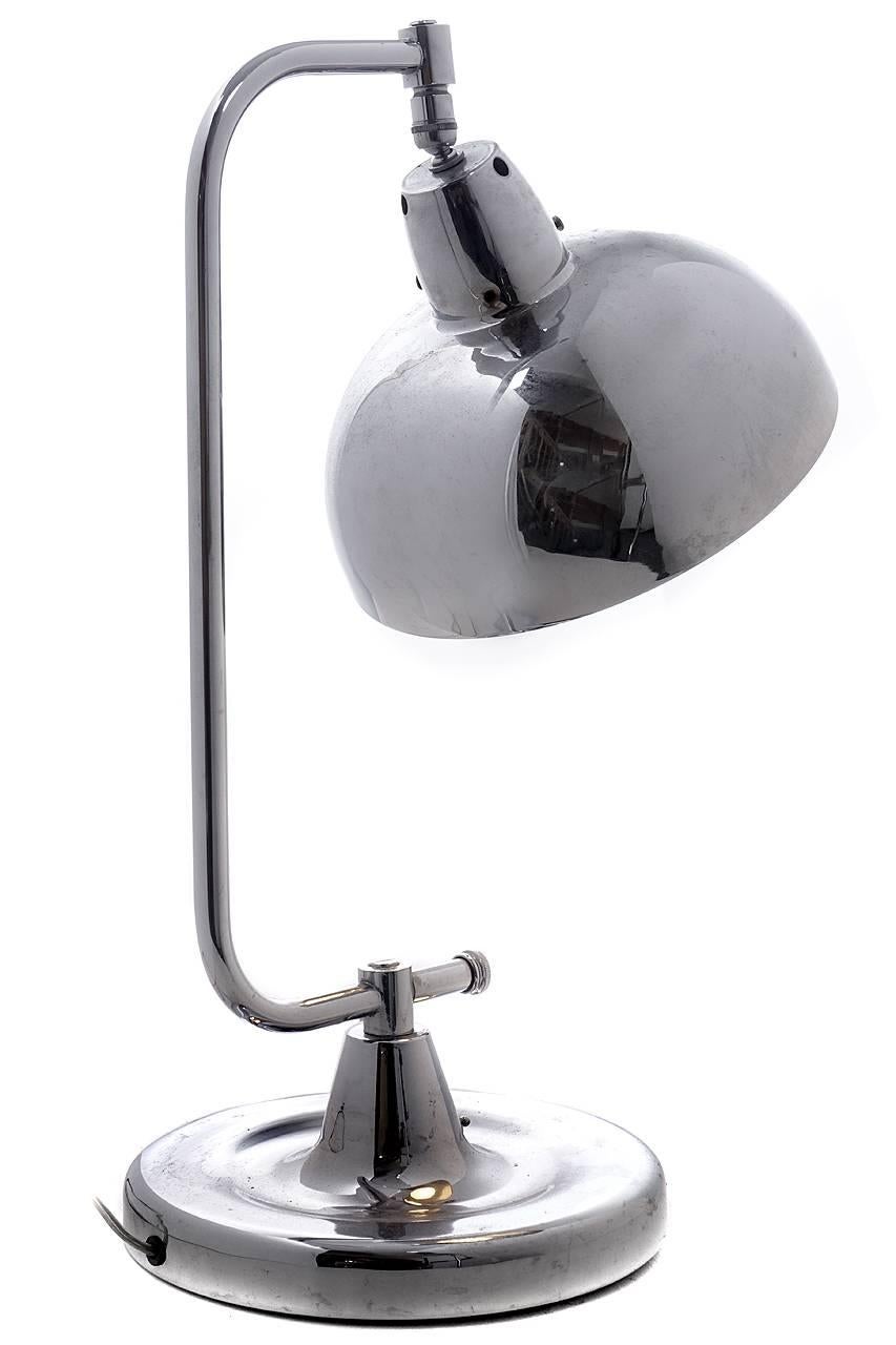 These are heavy Industrial quality chrome-plated table lamps. These lamps were very modern for the 1920s. They have a surprising Mid-Century Modern look for a lamp over 90 years old. The generous 10.5 inch diameter shade can move and tilt... Its a
