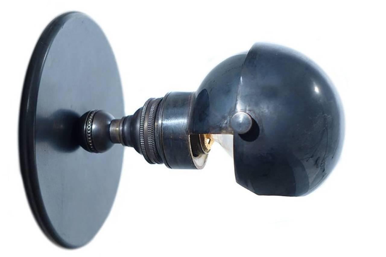 This small, simple and elegant geometric style sconce is a nod to turn of the century modernist Joseph Hoffman at his best. It has the look of a train car sconce. It’s delicately complex and understated and brings the sconce design down to its