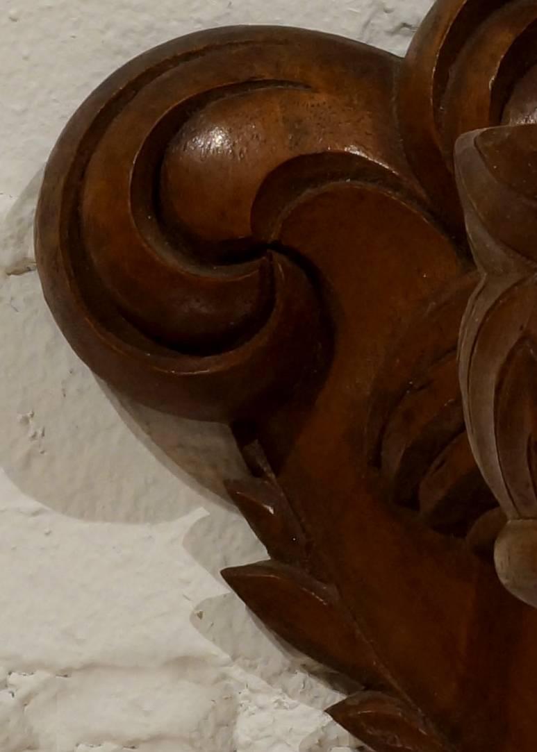 Carved German Art Deco carved walnut bird of paradise sconce