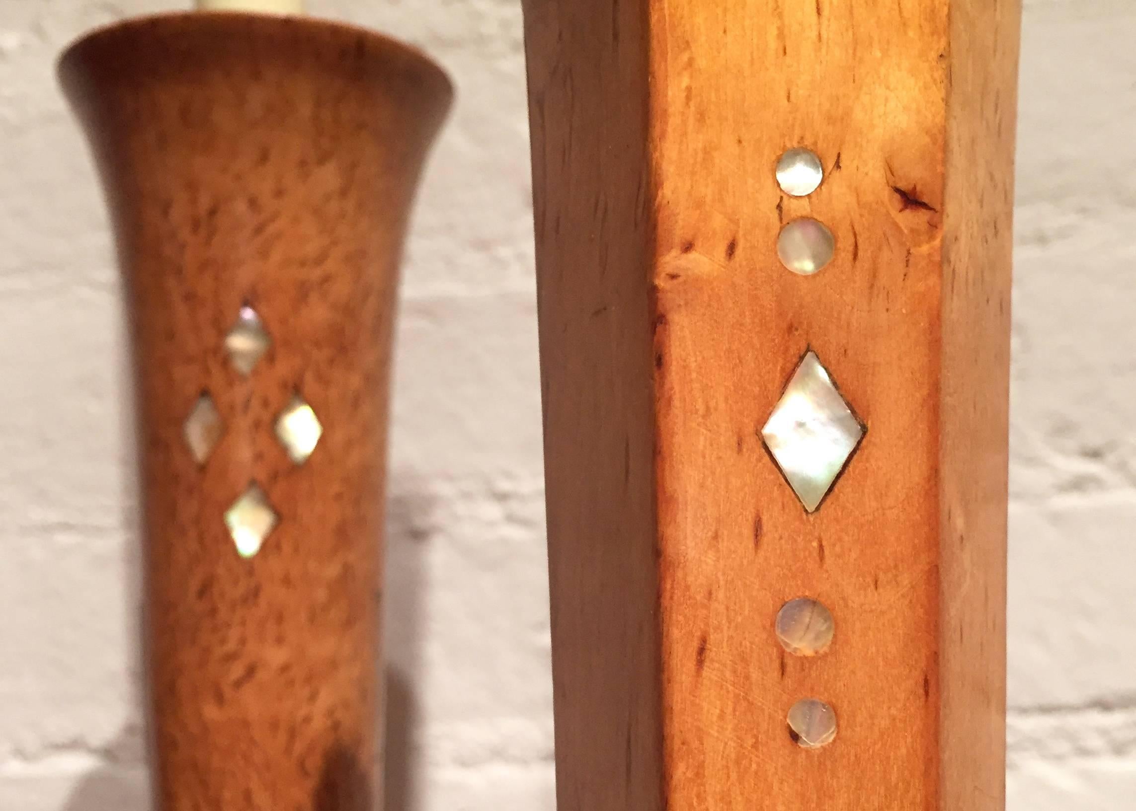 A pair of karelian birch candlesticks with mother-of-pearl inlay, c. 1910.