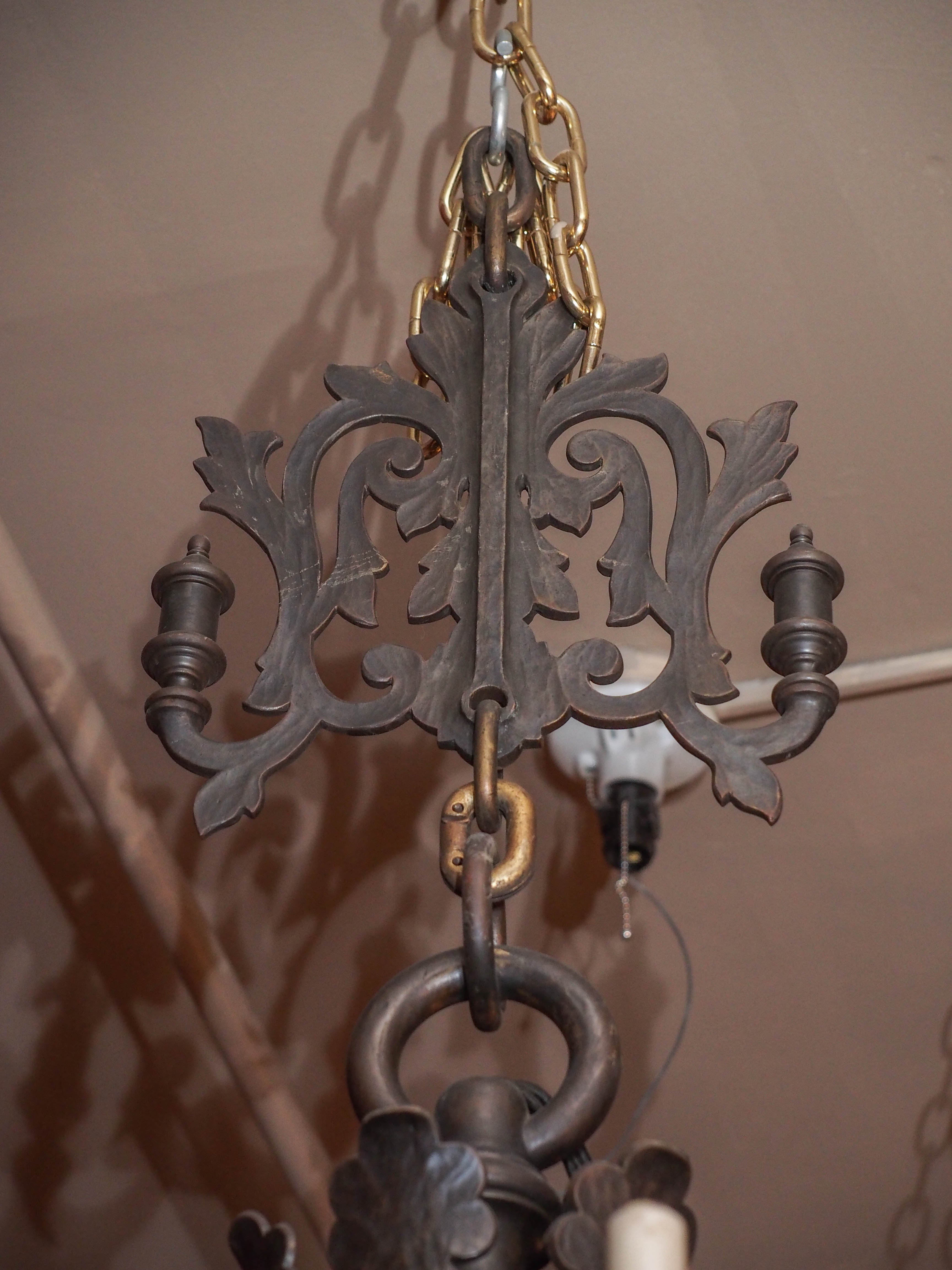 Antique Dutch bronze Renaissance chandelier, circa 1929. This chandelier is from a grand manor house.