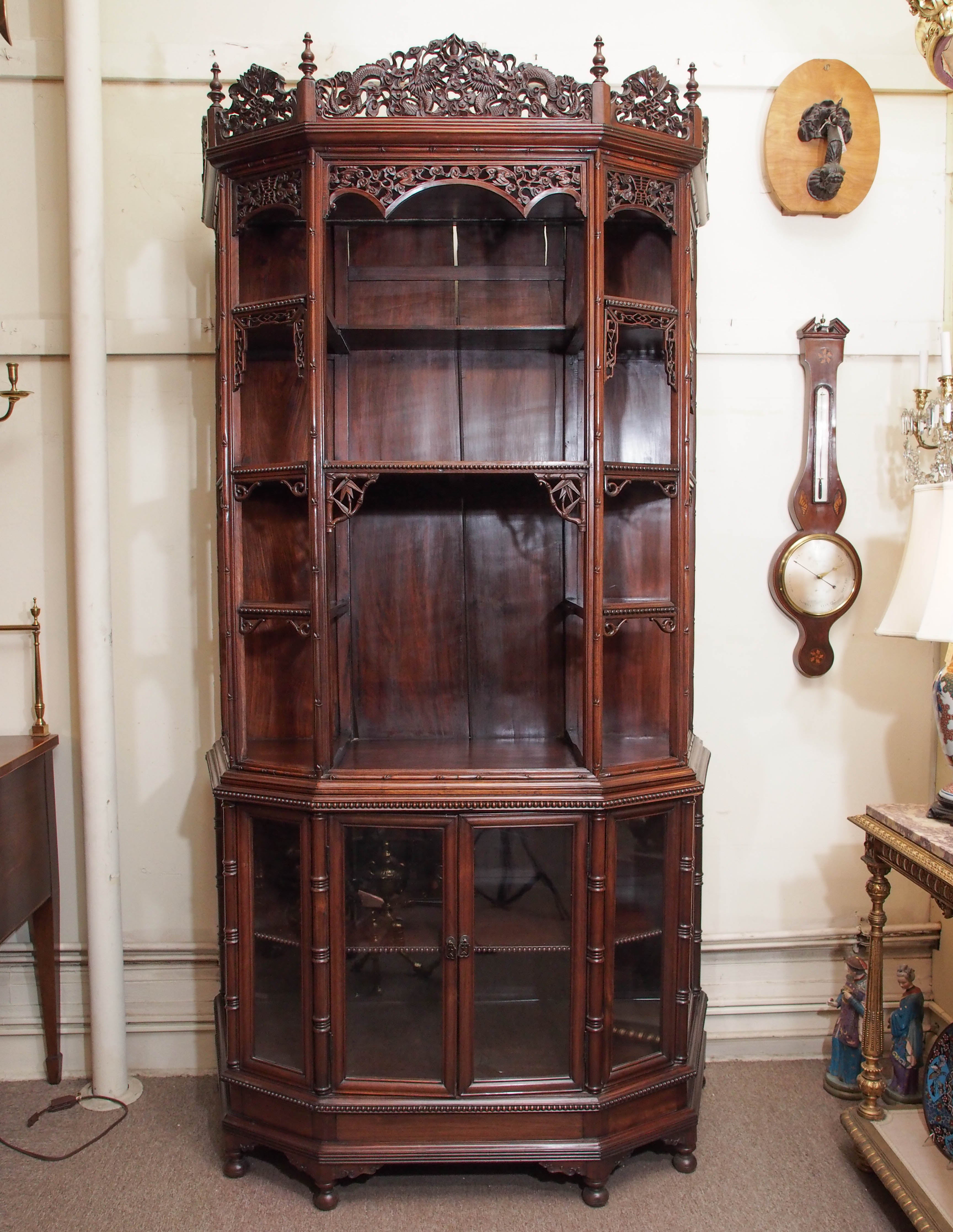 Magnificent antique carved teak cabinet, circa 1870-1880. This cabinet was purchased in England.