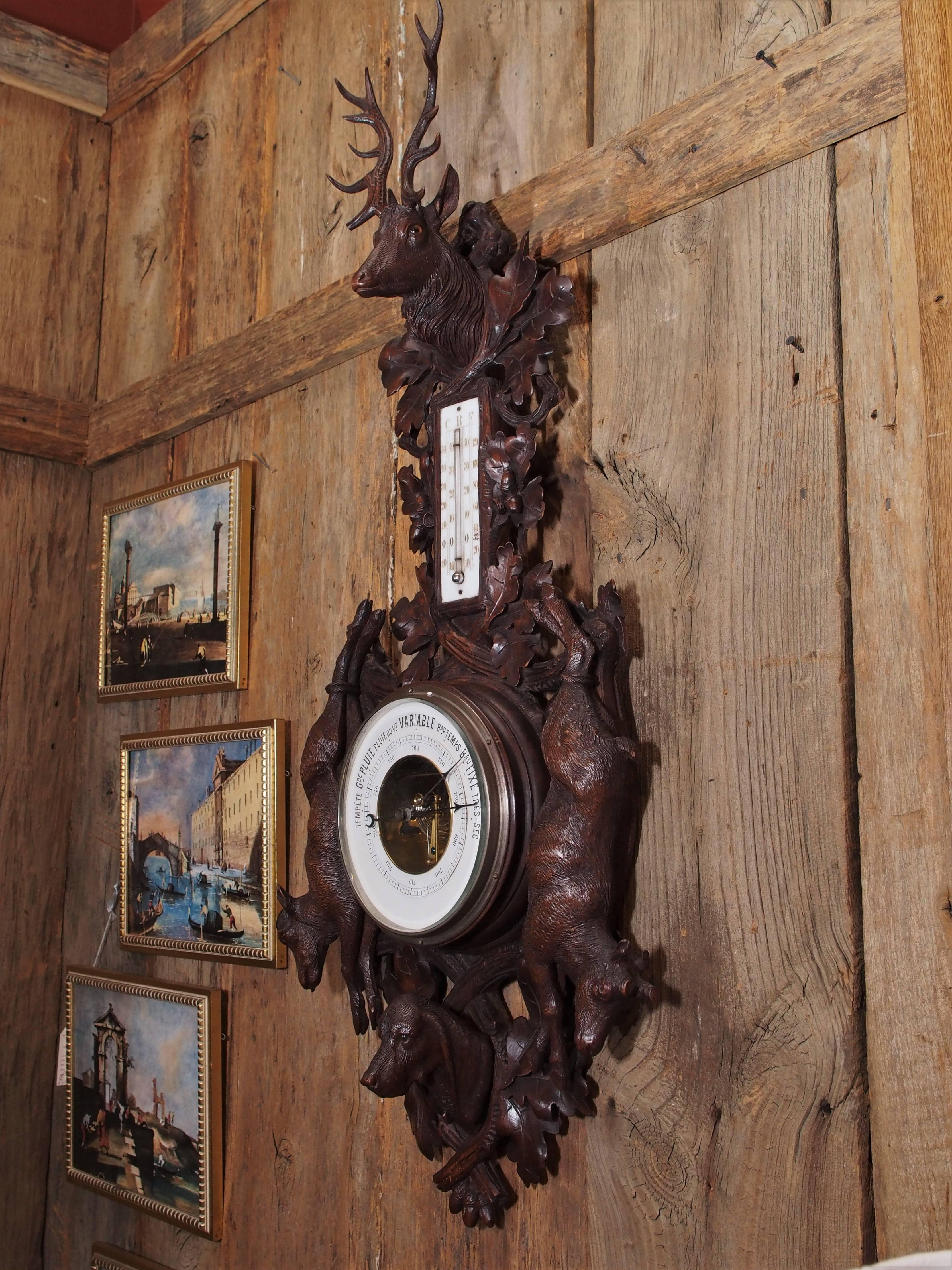 Antique black forest carved walnut barometer, circa 1880.