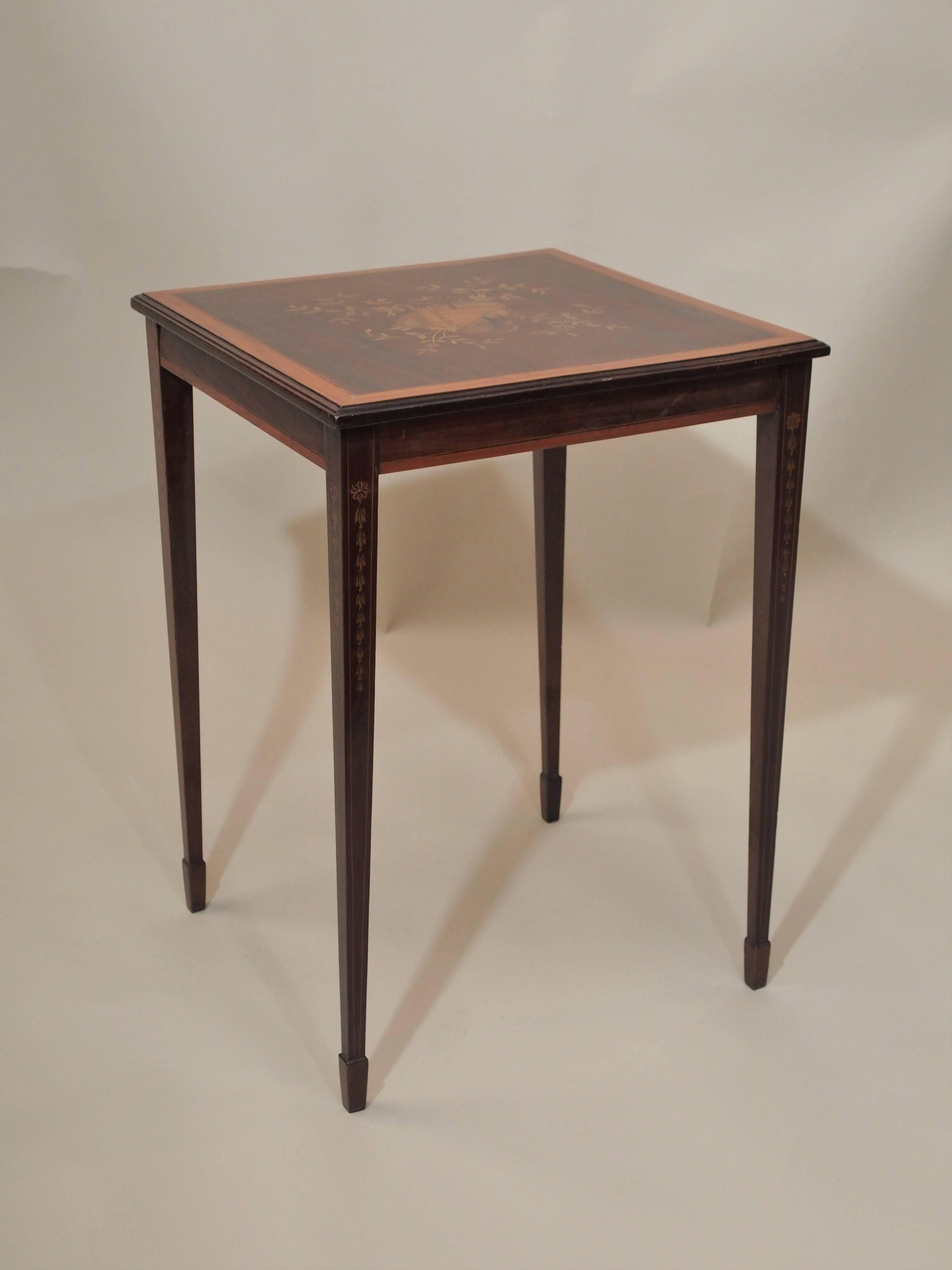 The inlay on this occasional table is very nice and typical of the period.