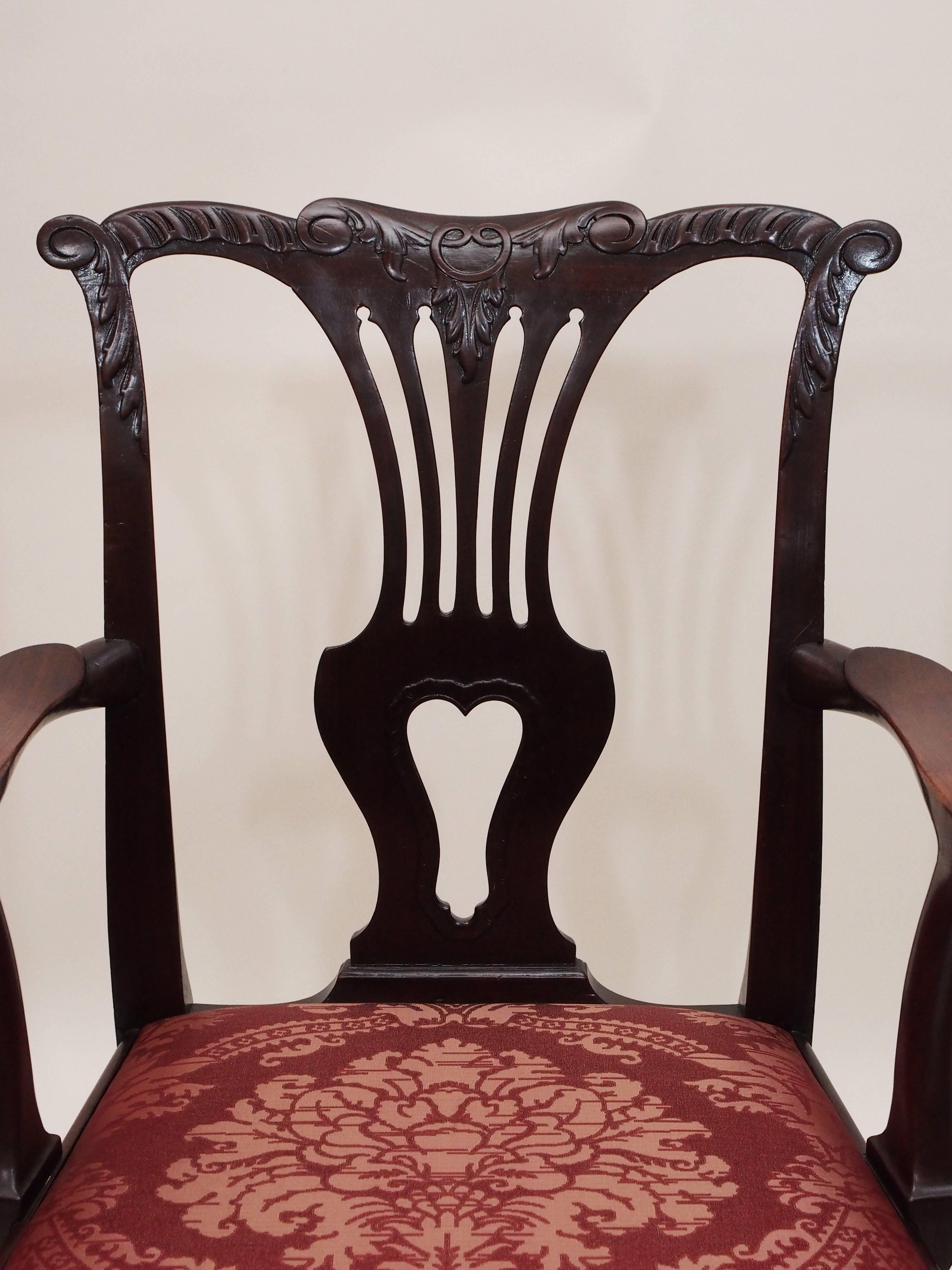 Set of 12 antique English mahogany 19th century dining chairs. The armchairs measure 39 inches high, 25 1/2 inches wide and 19 inches deep.