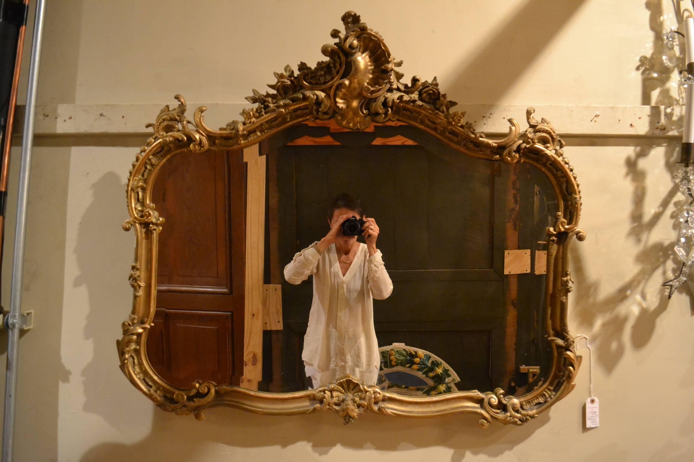 Antique French gold leaf beveled mirror, circa 1855-1865.