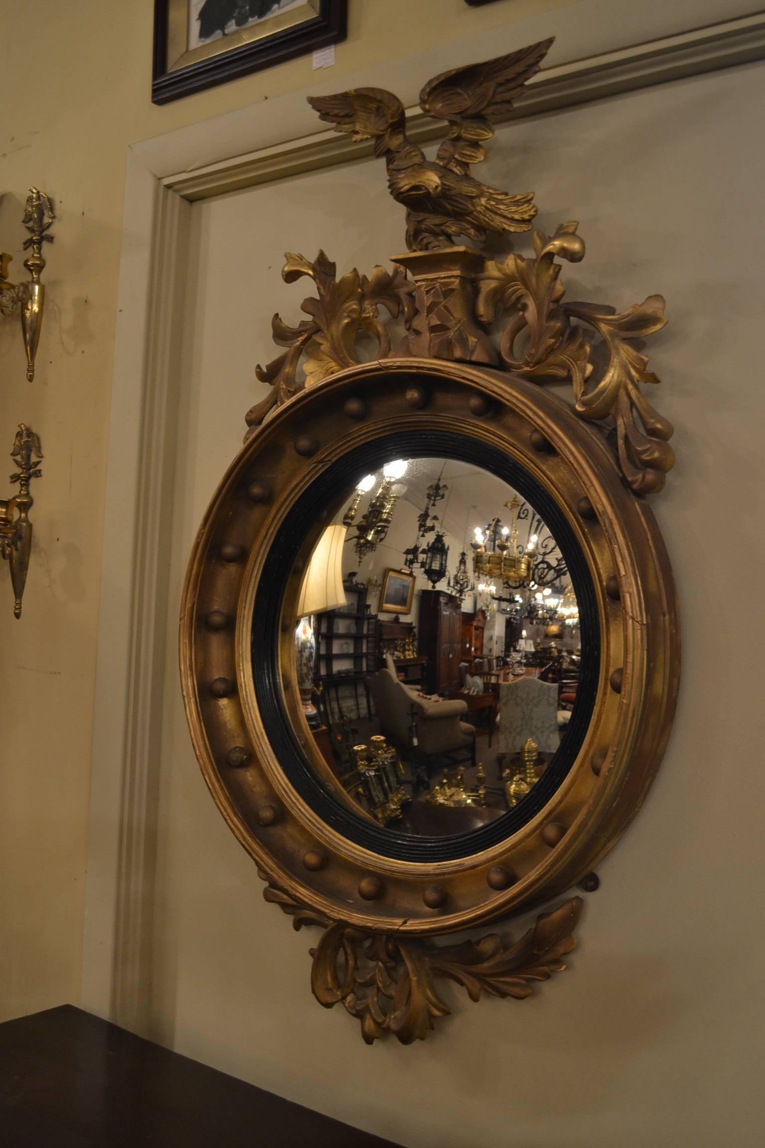 This lovely old mirror has its original gold leaf finish.