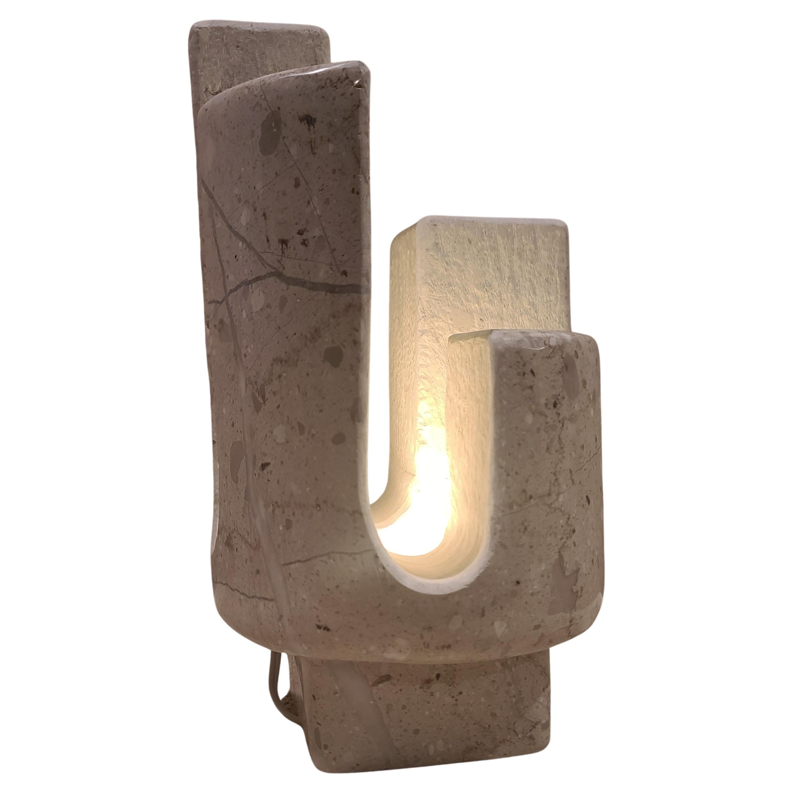 Elevate your space with our exquisite beige marble table lamp, a stunning fusion of nature and sophistication. Crafted in the shape of a cactus, this unique piece adds a touch of desert charm to any room. The rich beige marble base not only provides