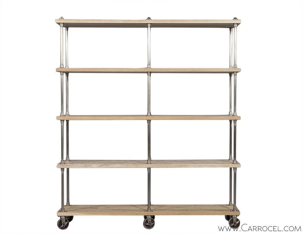 This etagere embodies industrial imperfection with five sand-blasted natural oak shelves and oiled, flanged steel supports.  Heavy, industrial locking casters ensure movement only when desired. A great way to showcase art and personal items with a