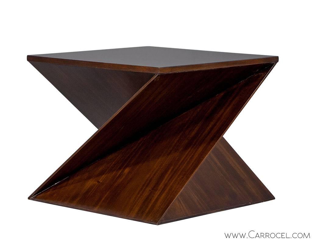 Made by EJ Victor, designed by Allison Paladino in her discernible style, this Twist End Table is constructed with quality and character. Modeled after the idea of pivoting a cube 90 degrees, the end table takes on a modern geometric conception