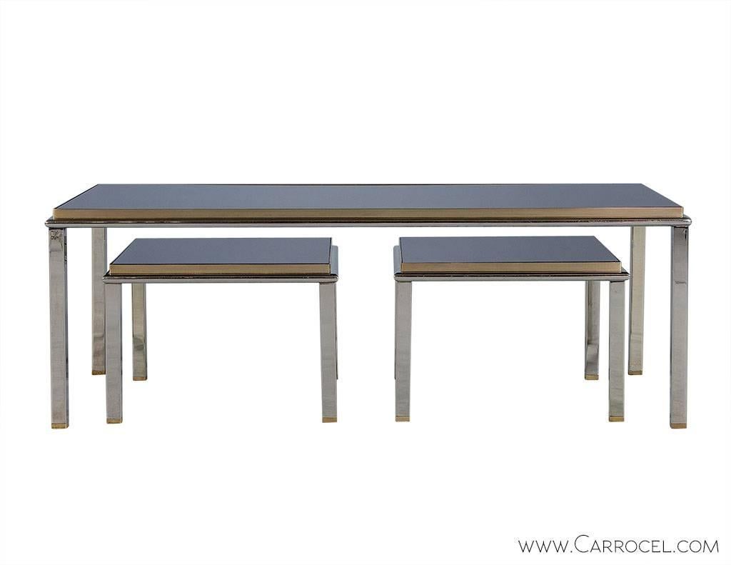 Part of the Carrocel Original Collection, this set of three tables combine to make an interesting piece. With one long central table, the two smaller nesting tables can be tucked in or pulled out to extend the overall surface area. Similarly