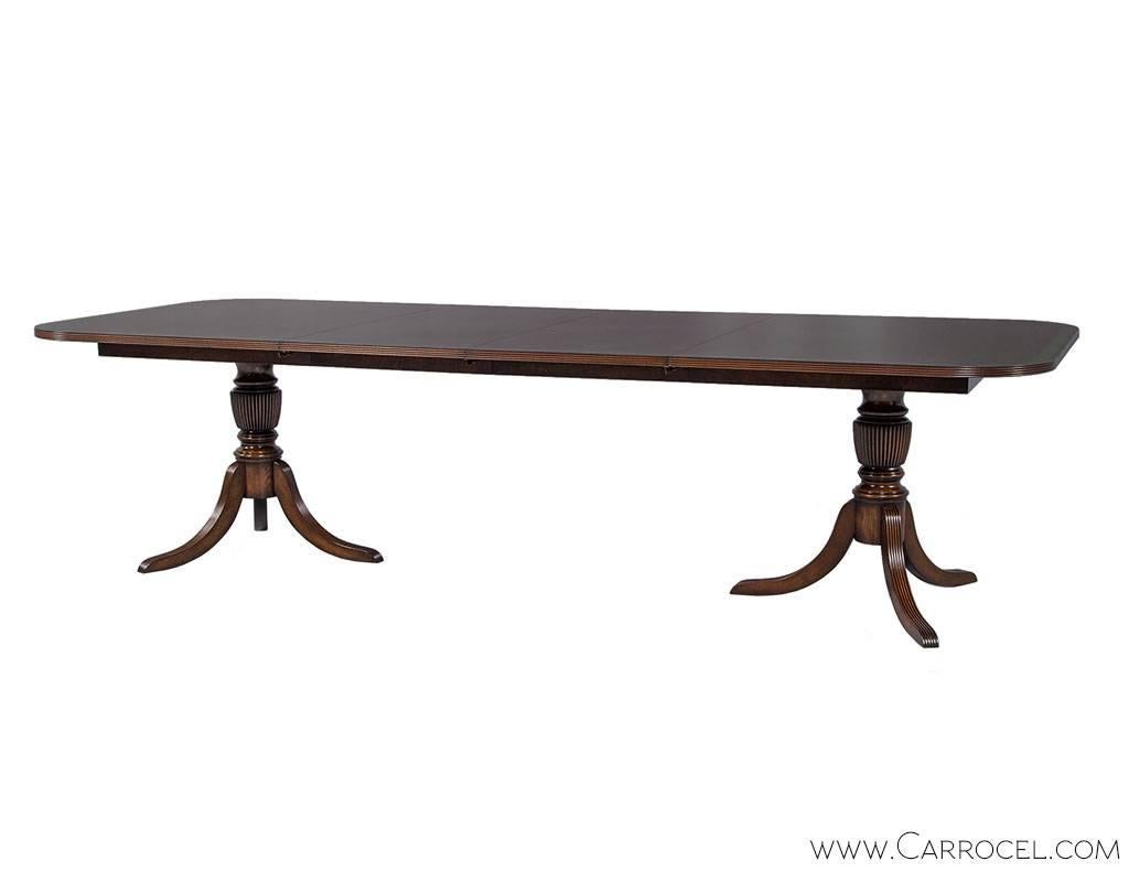 Canadian Carrocel Custom Flamed Mahogany Dining Table with Duncan Phyfe Style Pedestals