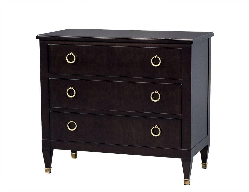 Built in the mid-20th century, this commode features pure form of crisp lines emphasizing the refined combination of walnut and brass. Restored by Carrocel craftsmen the custom espresso finish provides a striking contrast, highlighting the stunning