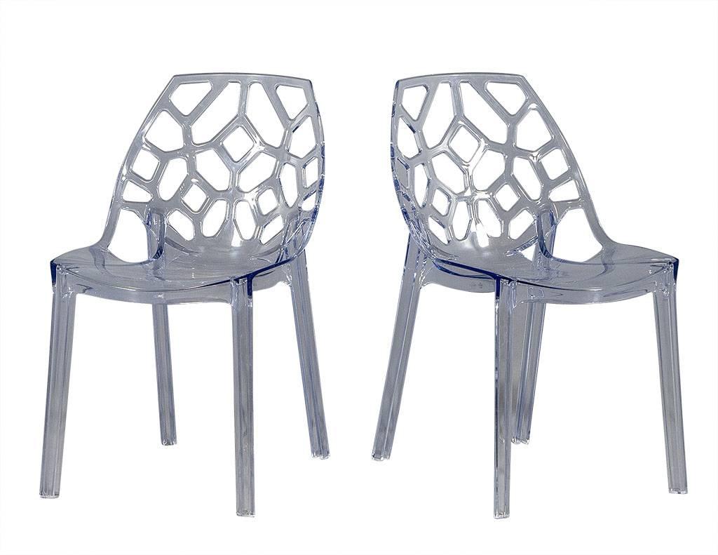 Modern acrylic chairs with honey comb patterned back. Shaped for ergonomic comfort yet small and minimal.