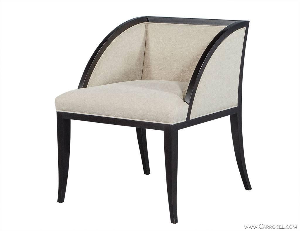 This Baker Palerme accent chair has been created in a transitional style. The satin black show wood frame contrasted with off white upholstery give this chair a simplistic pleasant aesthetic. Sophisticated approachable and comfortable, its an