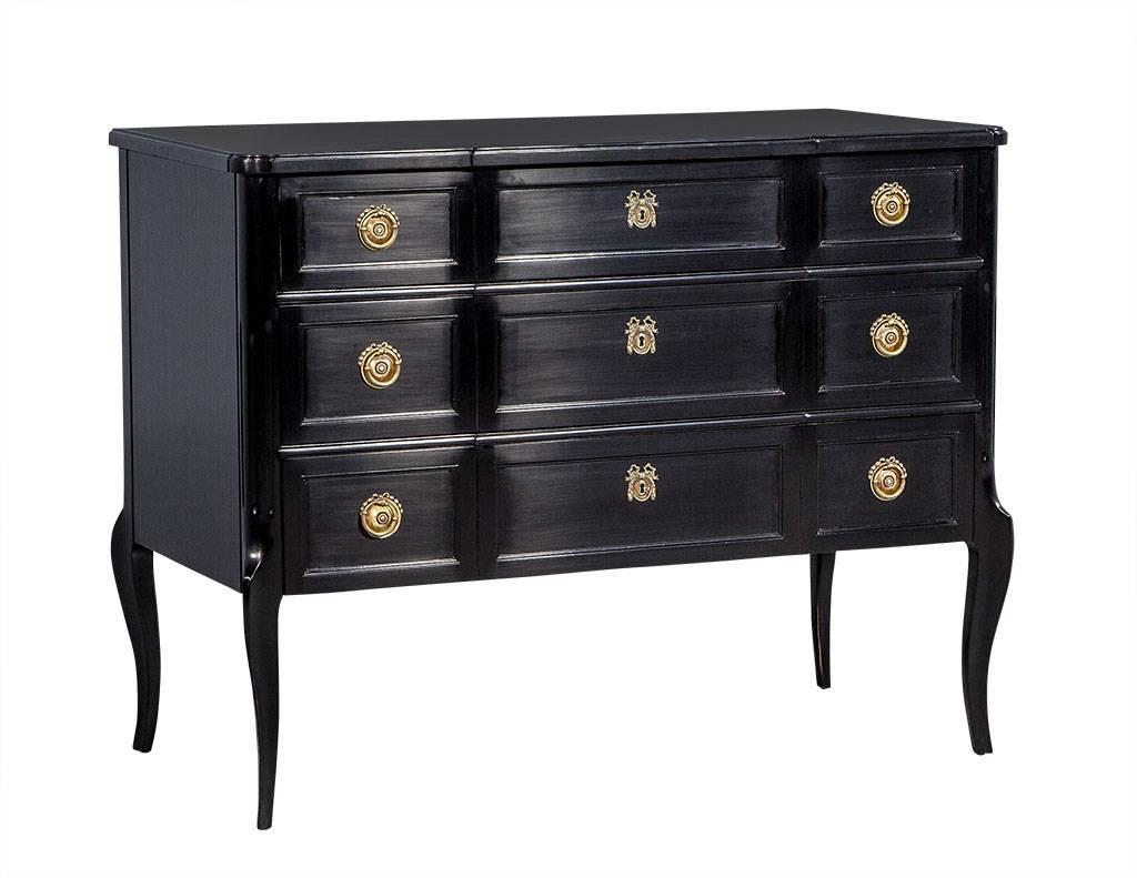 A Classic chest of drawers, newly modernized with in rich hand rubbed black lacquer. The chest features a three-drawer case lifted slightly on exquisitely tapered curved legs. The top drawer has been outfitted with interior dividers and all three