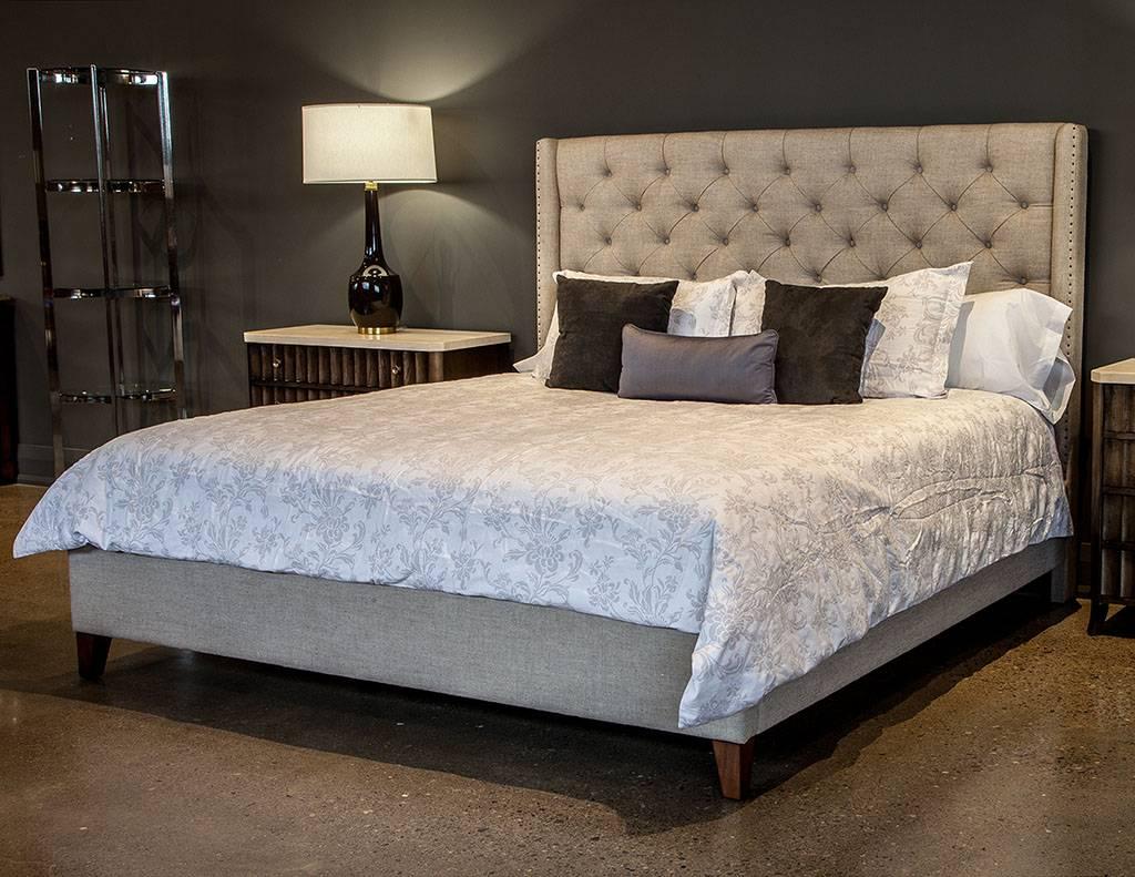 Lounge, relax and dream in this beautiful bed. Featuring lush Belgian linen tufted across the head board and wrapped around the side a foot boards, trimmed with nails. A perfect mix of style and comfort. Mattress not included. King-size only
