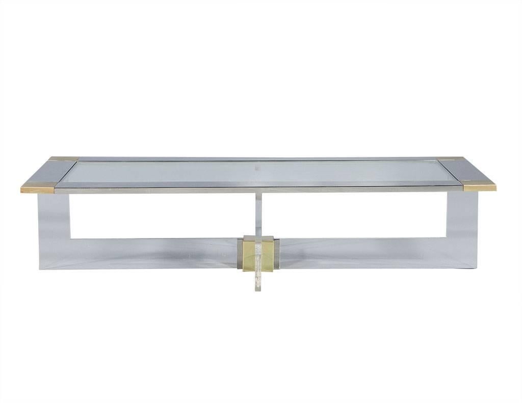 Designed by Randall Tysinger, this cocktail table is a visual pleasure for the modern furniture lover. The bold straight edge geometric construction of the t-base supporting a rectangular top integrates well with the use of pure materials, acrylic