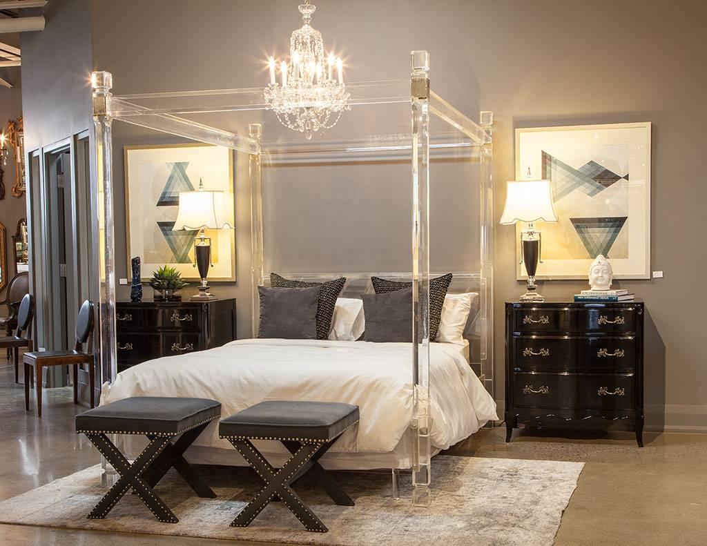 This beautiful four-poster bed is comprised of a Lucite frame and metal laminate accents. The style is perfectly Mid Century Modern flashed back from the 1960s and a luxe centerpiece of an elegant bedroom!