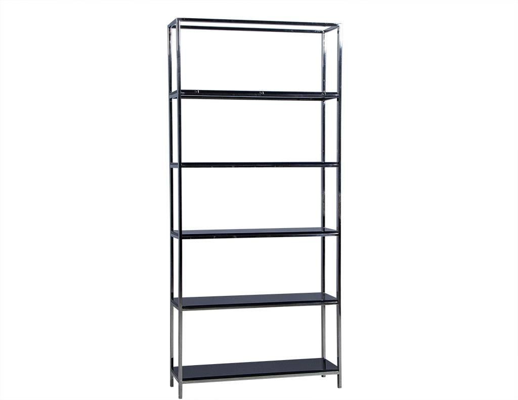 This sleek etagere is framed with polished stainless and adorned with five black lacquered wood shelves. It is the perfect addition to any bathroom to store fluffy towels and perfume bottles, or to any living room to store books and other decorative
