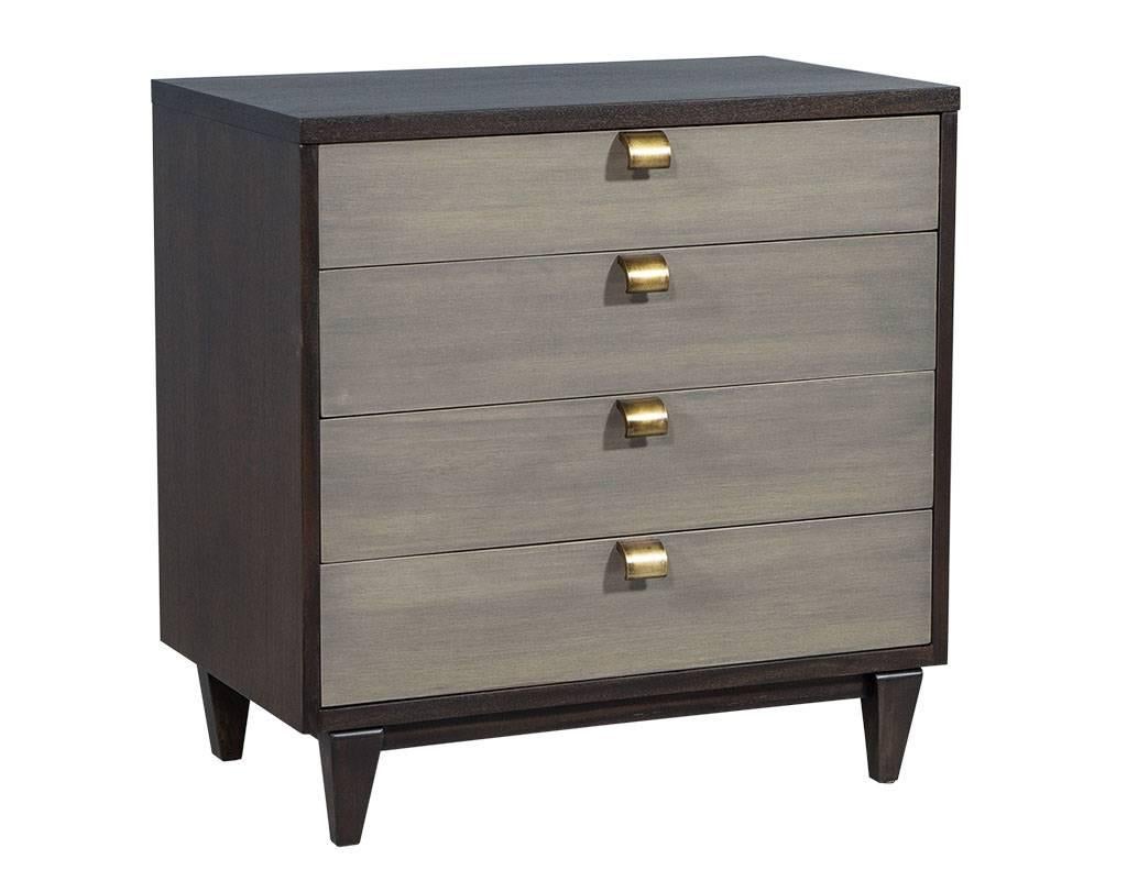 This contemporary chest is a true beauty. It showcases a light espresso finish on the frame with four light grey stained drawers all atop tapered wooden legs. Each drawer is lined with velvet fabric and there are four wooden dividers in the top