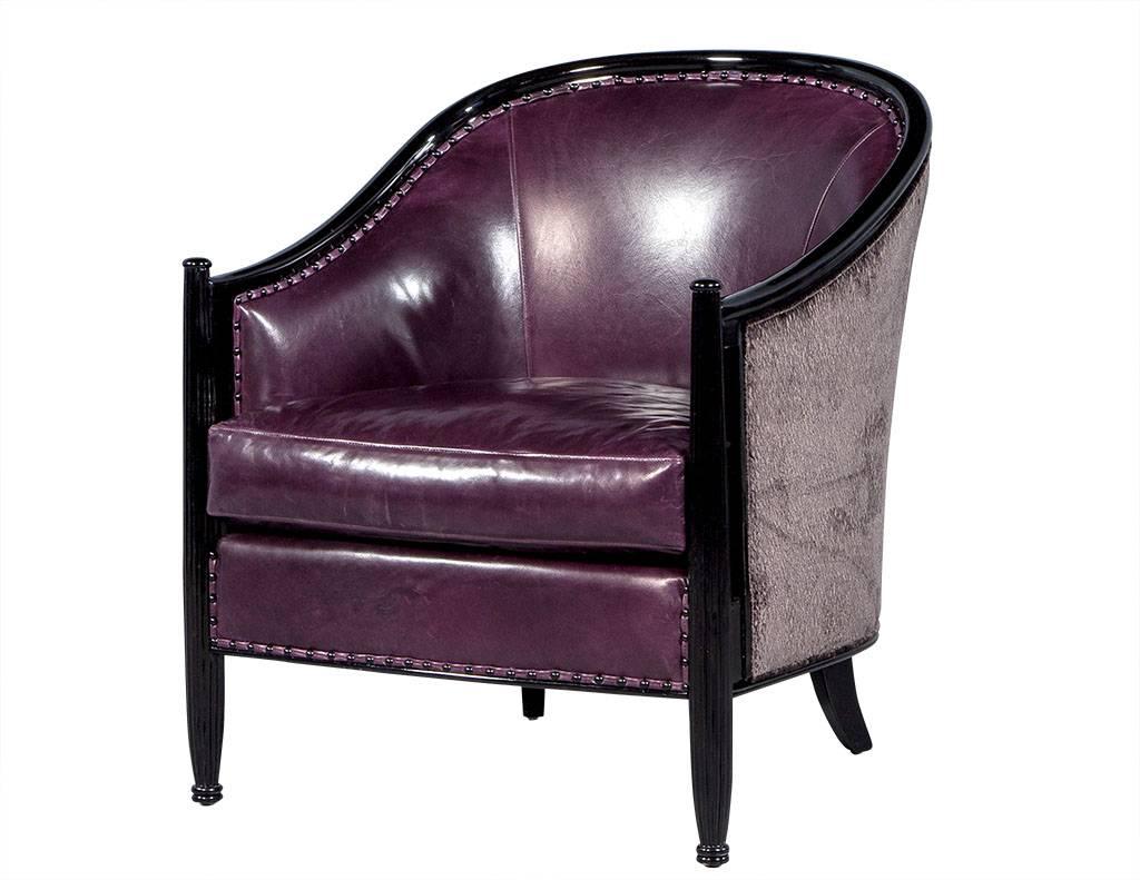 Part of the Carrocel Custom collection, these Art Deco inspired frames feature a deep, curved back and expertly finished in a sleek black high gloss lacquer. Upholstered in a dark, slightly distressed purple leather on the inside of the chair and in