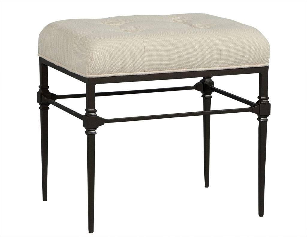 These traditional style stools are a lesson in contrast. The creamy, tufted fabric sits atop a sleek, cast iron frame and four slim legs. One stool is slightly darker than the other, and they both make for beautiful seating in any room.