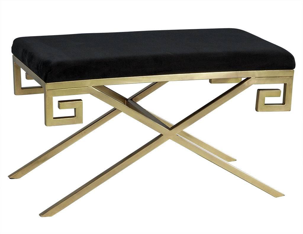 These modern stools are absolutely elegant. They each have a black velvet top with a Greek key designed, X-base, brushed brass frame. A perfect set for a richly designed home.