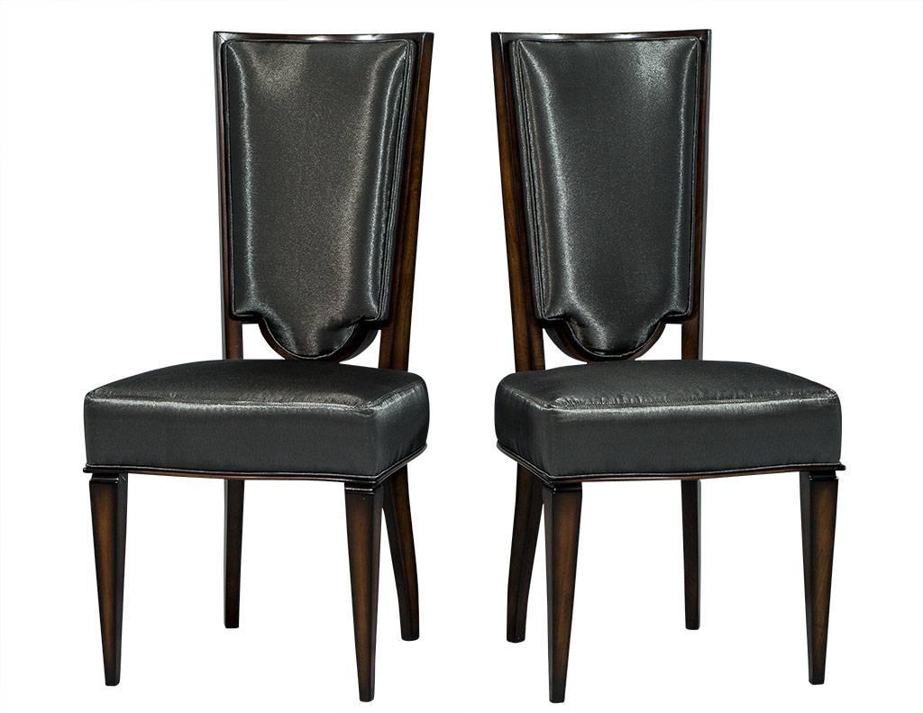 These Art Deco dining chairs are absolutely divine. They sit atop the original Art Deco frames with high backs and fluted legs. The legs are refinished in a dark chestnut stain, and the raised inside back and box seat is upholstered in a shiny