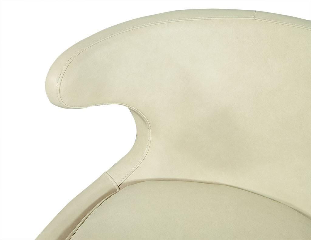 Stainless Steel Pair of Cream Leather Retro Style Lounge Chairs