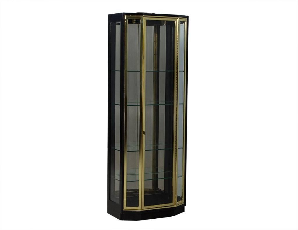 glass and brass curio cabinet