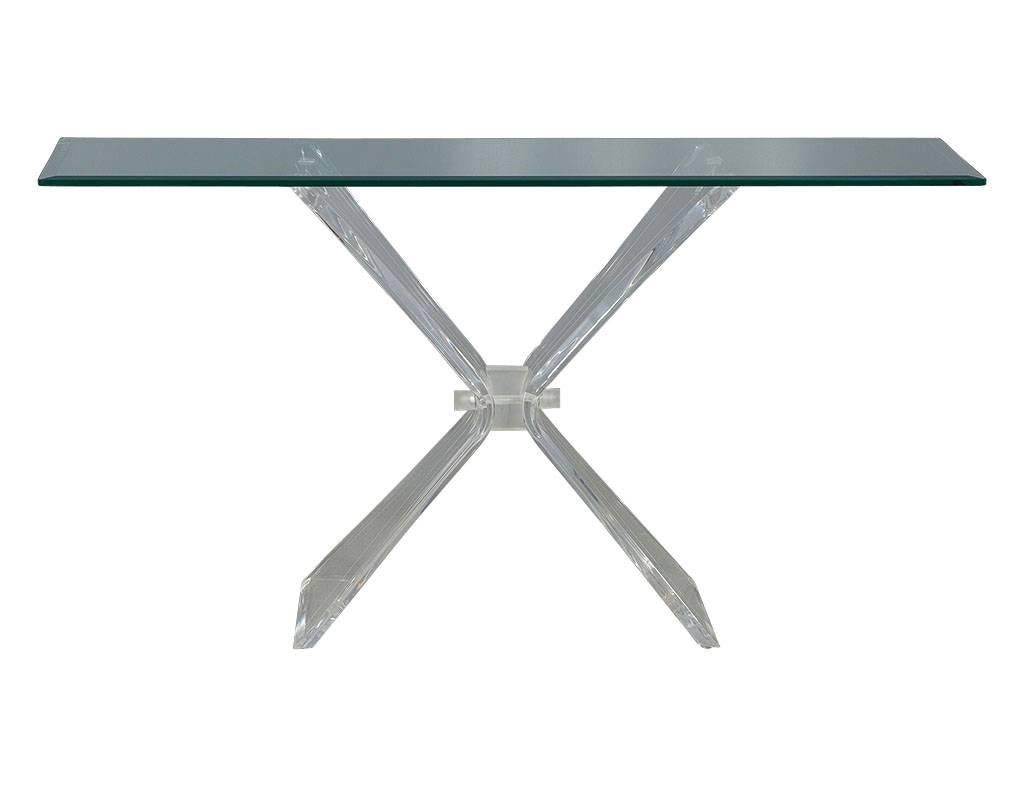Stunning vintage Hollywood Regency style console table attributed to the design from Lion in Frost. With a butterfly pedestal and thick, rectangular, beveled edge glass top this piece is a defining design from the Mid-Century Era. In excellent