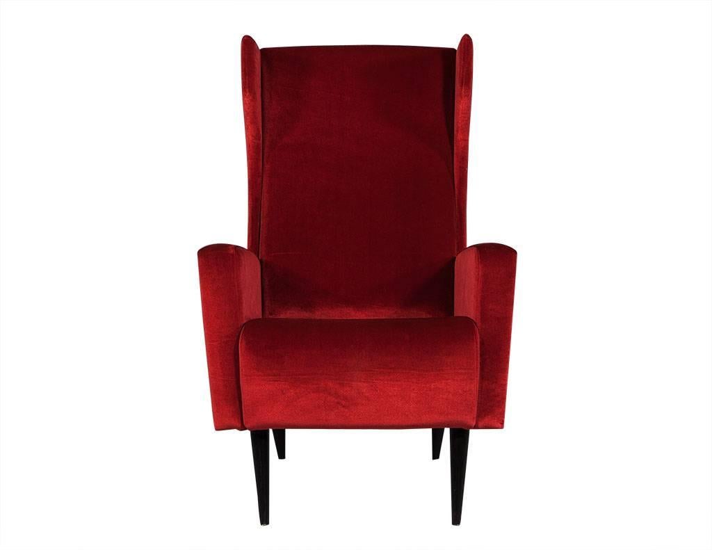 Mid-Century Modern design with a sleek bright fire engine red velvet, high backs with proportionate square arm. Comfortable deep plush seats with four thin tapered wooden legs in a dark espresso finish.

Chairs are now offered and priced